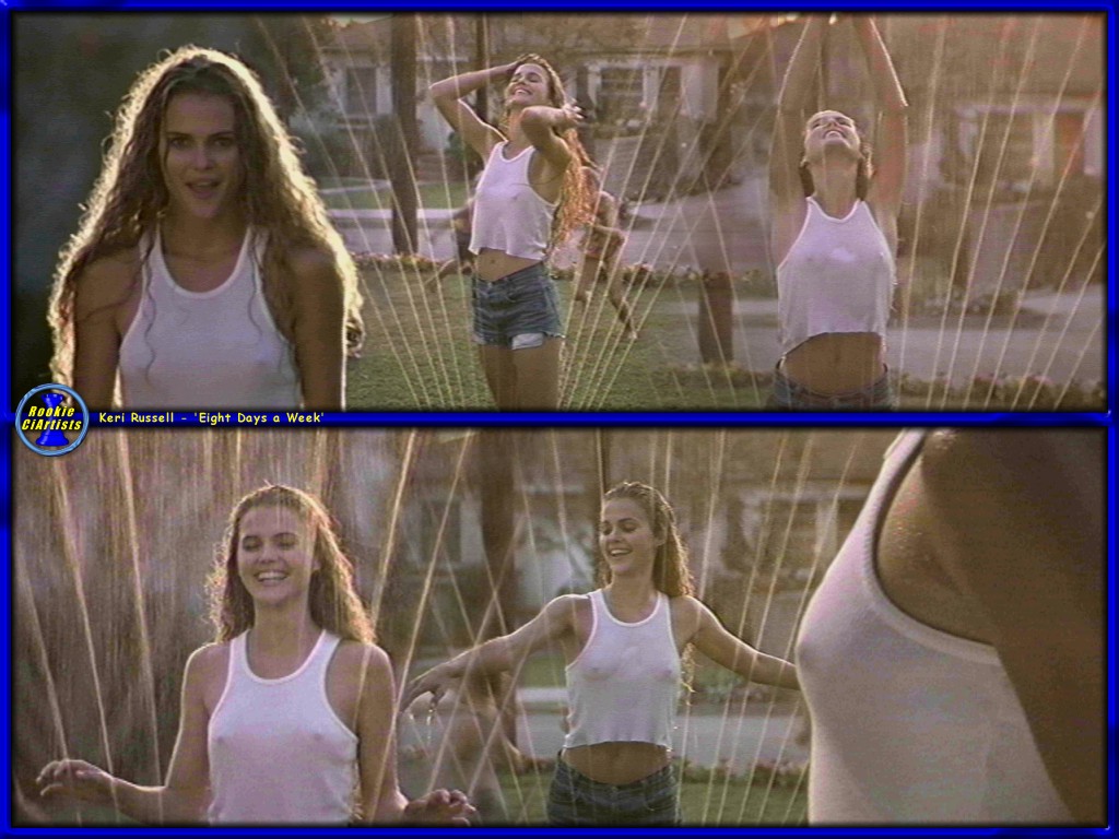 A young Keri Russell runs through a sprinkler with no bra on - Eight Days a Week