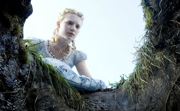 Mia Wasikowska - Alice peers down the rabbit hole in Alice in Wonderland