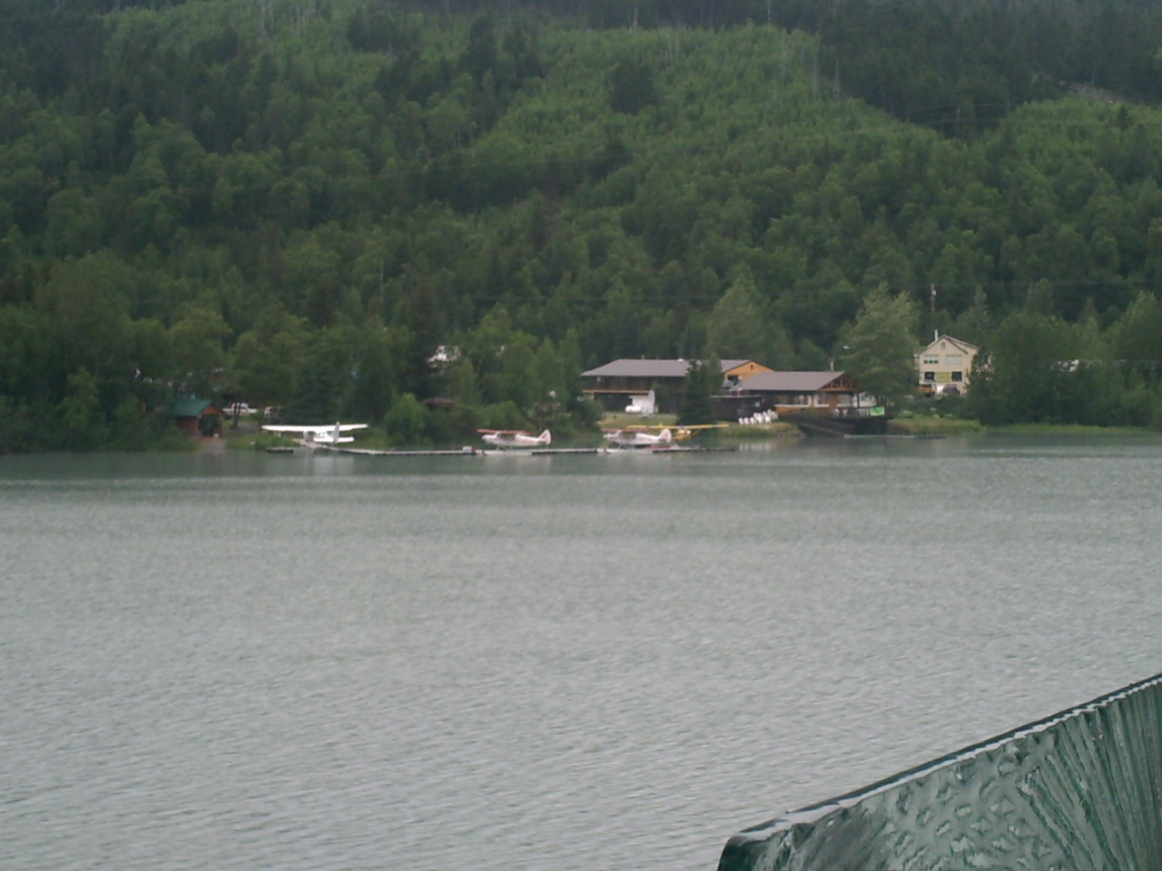 Alaska float planes docked on lake