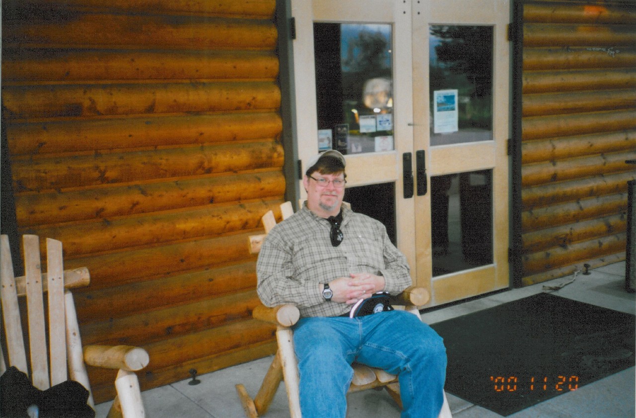Old man Roland Hansen in front of the Seward Windsong Lodge