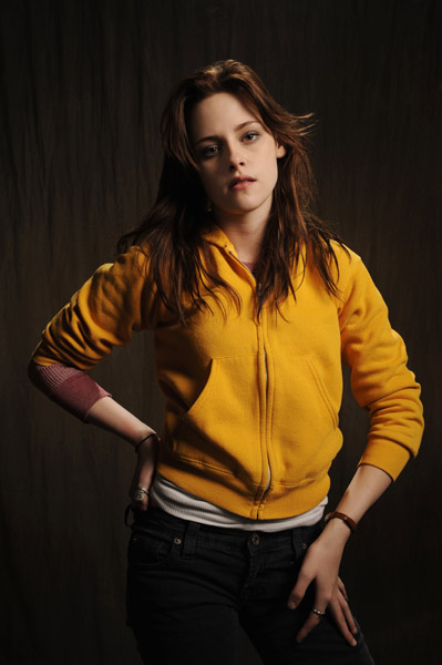 Kristen Stewart - black jeans and yellow sweatshirt