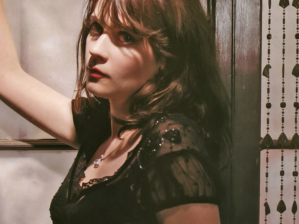 Zooey Deschanel - sheer black dress with diamond necklace