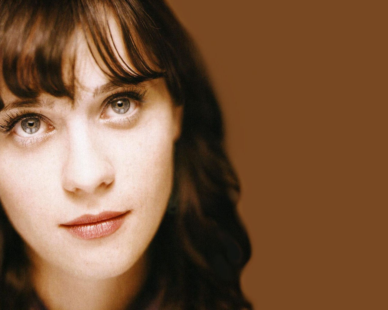 Zooey Deschanel - her eyes look grey in this headshot