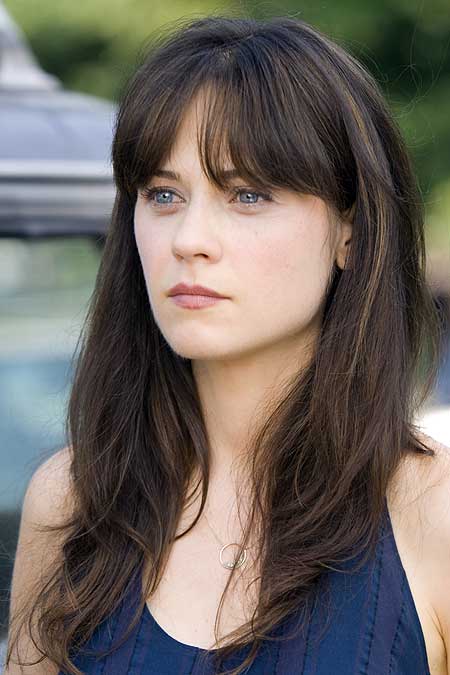 Zooey Deschanel looks very serious in blue dress