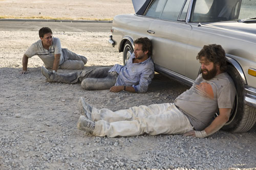 Bradley Cooper, Ed Helms, Zach Galifianakis - lying in the dirt - The Hangover